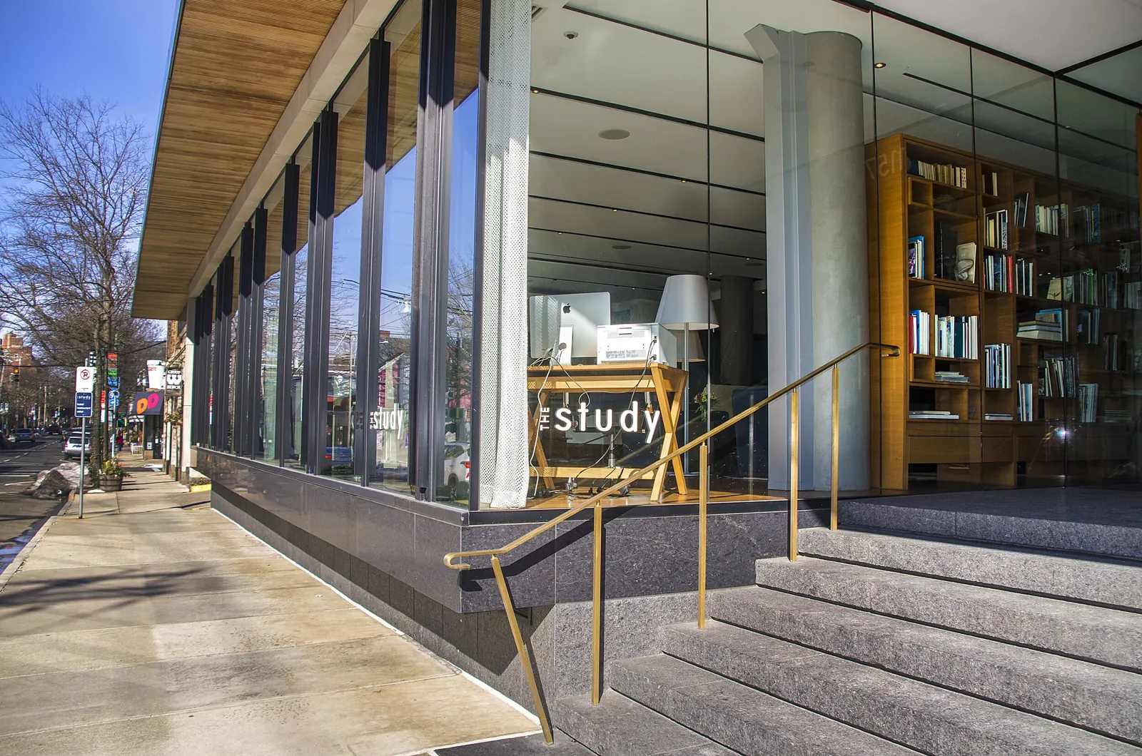 The glass frontage of The Study at Yale, looking down the Chapel Street sidewalk
